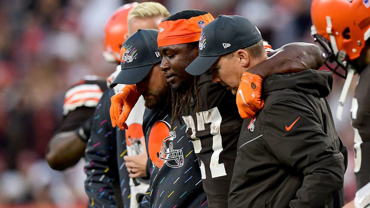 CLEVELAND, OHIO - OCTOBER 17: Kareem Hunt #27 of the Cleveland Browns is helped off the field by team medical personnel after an injury during the fourth quarter against the Arizona Cardinals at FirstEnergy Stadium on October 17, 2021 in Cleveland, Ohio.