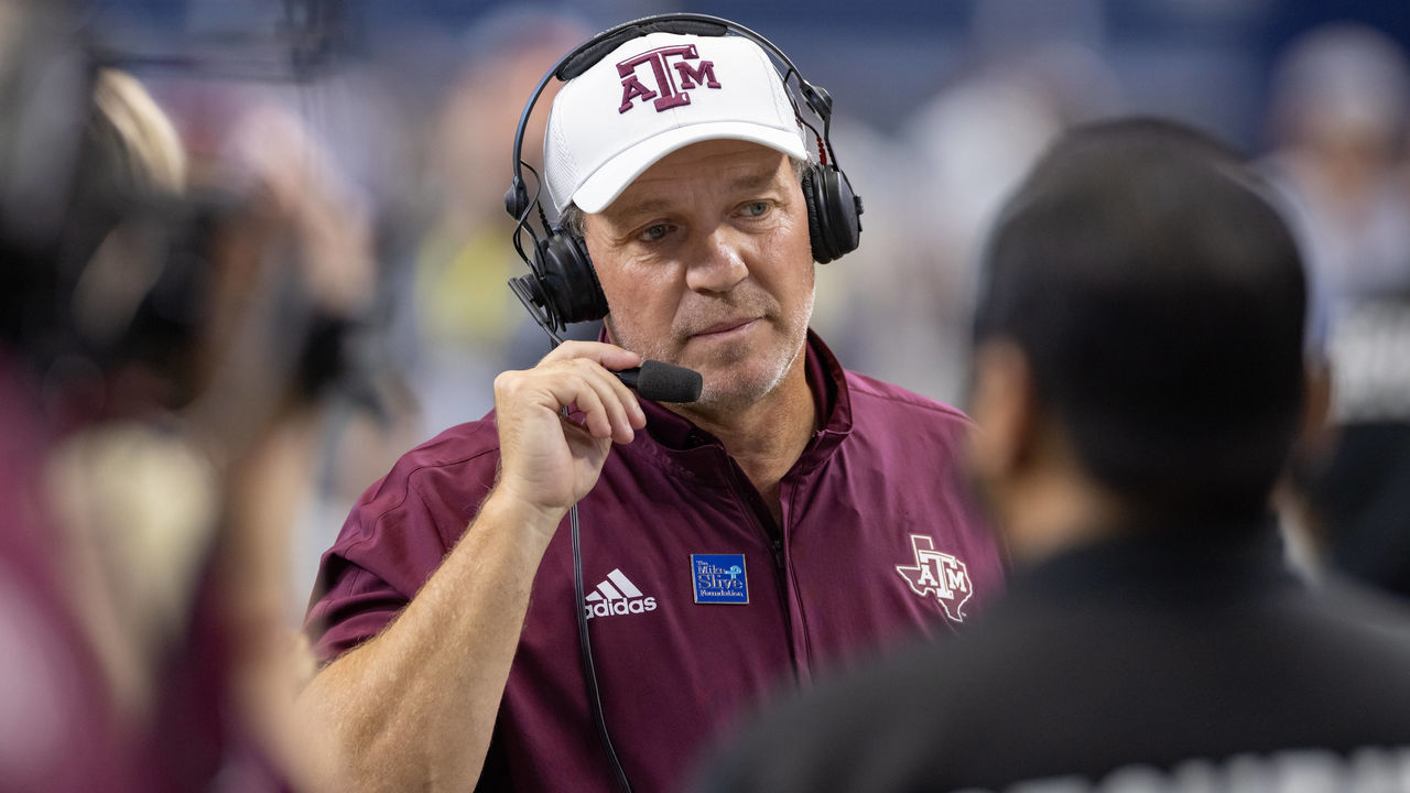 ARLINGTON, TX - SEPTEMBER 25: Texas A&M Aggies head coach Jimbo Fisher is interviewed on the field during the Southwest Classic college football game between the Texas A&M Aggies and Arkansas Razorbacks on September 25, 2021 at AT&T Stadium in Arlington, TX.