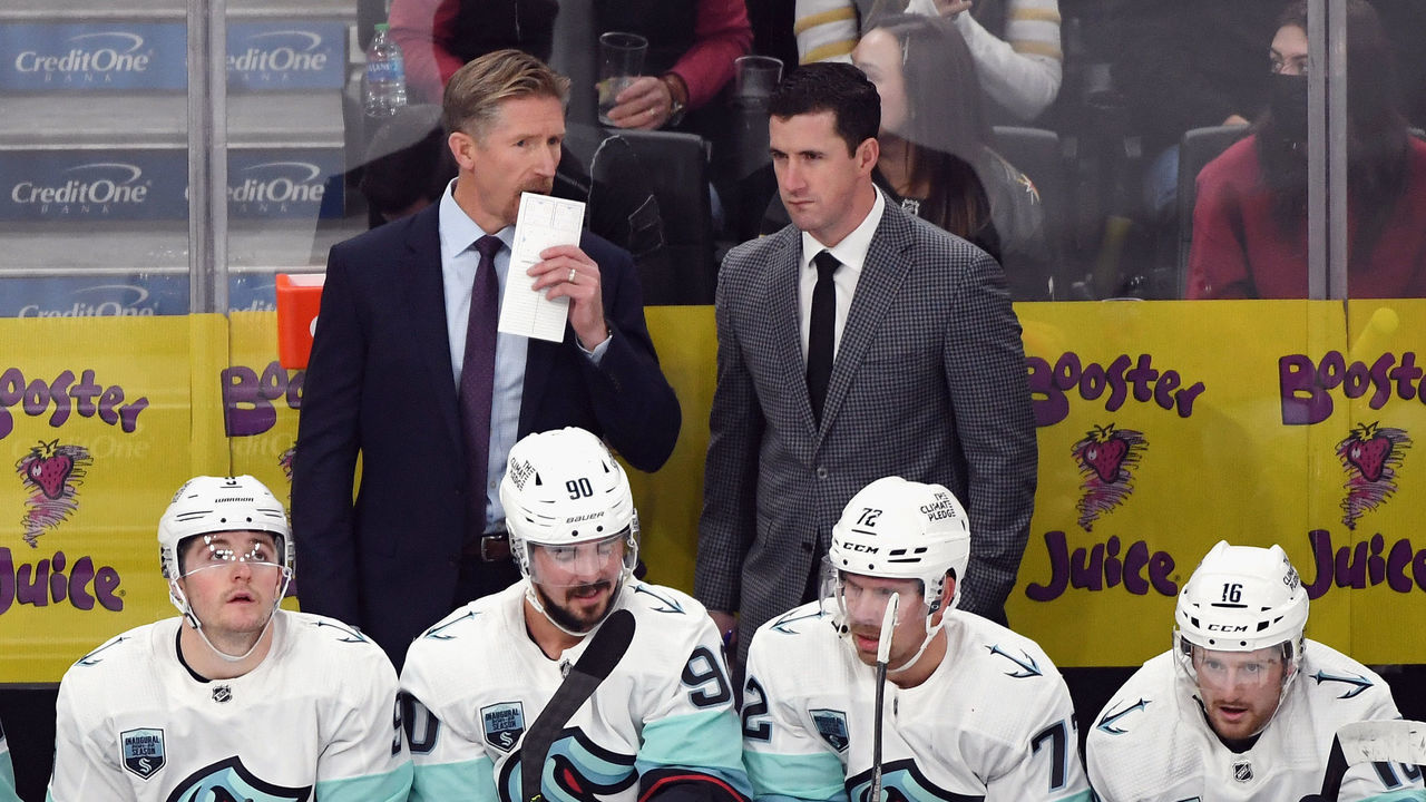 LAS VEGAS, NEVADA - OCTOBER 12: (L-R) Head coach Dave Hakstol and assistant coach Paul McFarland of the Seattle Kraken work the bench against the Vegas Golden Knights during the first period of the Kraken's inaugural regular-season game at T-Mobile Arena on October 12, 2021 in Las Vegas, Nevada.