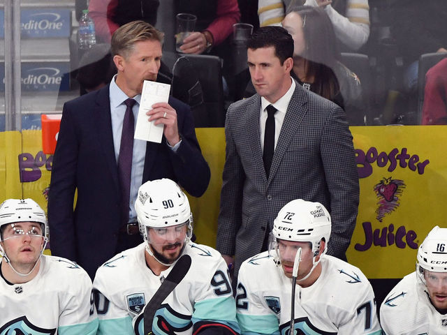 LAS VEGAS, NEVADA - OCTOBER 12: (L-R) Head coach Dave Hakstol and assistant coach Paul McFarland of the Seattle Kraken work the bench against the Vegas Golden Knights during the first period of the Kraken's inaugural regular-season game at T-Mobile Arena on October 12, 2021 in Las Vegas, Nevada.
