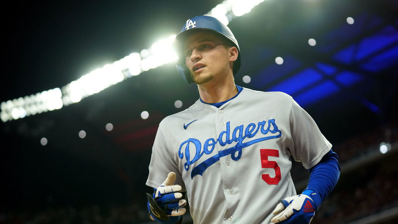 ATLANTA, GA - OCTOBER 17: Corey Seager #5 of the Los Angeles Dodgers returns to the dugout after hitting a two-run home run in the top of the first inning of Game 2 of the NLCS between the Los Angeles Dodgers and the Atlanta Braves at Truist Park on Sunday, October 17, 2021 in Atlanta, Georgia.