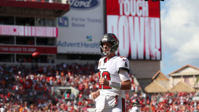 TAMPA, FL - OCTOBER 10: Tampa Bay Buccaneers Quarterback Tom Brady (12) trots towards the end zone after throwing a touchdown to Mike Evans during the regular season game between the Miami Dolphins and the Tampa Bay Buccaneers on October 10, 2021 at Raymond James Stadium in Tampa, Florida.