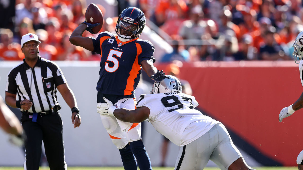DENVER, CO - OCTOBER 17: Denver Broncos quarterback Teddy Bridgewater (5) gets pressured by Las Vegas Raiders defensive tackle Damion Square (97) during a NFL game between the Las Vegas Raiders and the Denver Broncos on October 17, 2021 at Empower Field at Mile High in Denver, CO.