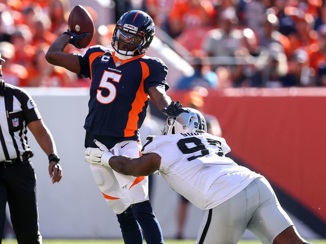 Denver Broncos quarterback Teddy Bridgewater (5) is pressured by Las Vegas  Raiders defensive en …