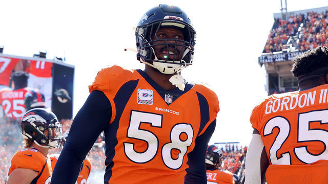 DENVER, COLORADO - OCTOBER 03: Von Miller #58 of the Denver Broncos takes the field with teammates before the game against the Baltimore Ravens at Empower Field At Mile High on October 03, 2021 in Denver, Colorado.