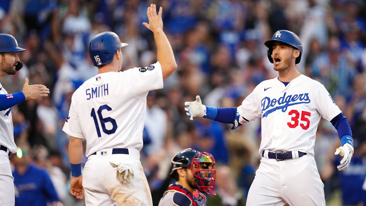 LOS ANGELES, CA - OCTOBER 19: Cody Bellinger #35 of the Los Angeles Dodgers celebrates with Will Smith #16 after hitting a three-run home run in the eighth inning of Game 3 of the NLCS between the Atlanta Braves and the Los Angeles Dodgers at Dodgers Stadium on Tuesday, October 19, 2021 in Los Angeles, California.