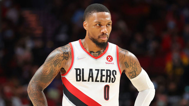 PORTLAND, OREGON - OCTOBER 04: Damian Lillard #0 of the Portland Trail Blazers looks on in the second quarter against the Golden State Warriors during the preseason game at Moda Center on October 04, 2021 in Portland, Oregon.
