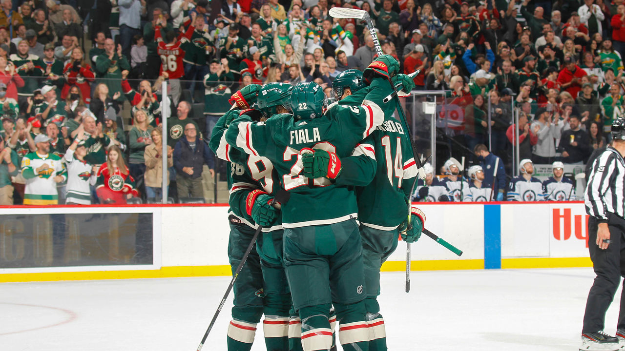 SAINT PAUL, MN - OCTOBER 19: (L-R) Mats Zuccarello #36, Kirill Kaprizov #97, Kevin Fiala #22 and Joel Eriksson Ek #14 of the Minnesota Wild celebrate a goal against the Winnipeg Jets during the game at the Xcel Energy Center on October 19, 2021 in Saint Paul, Minnesota.