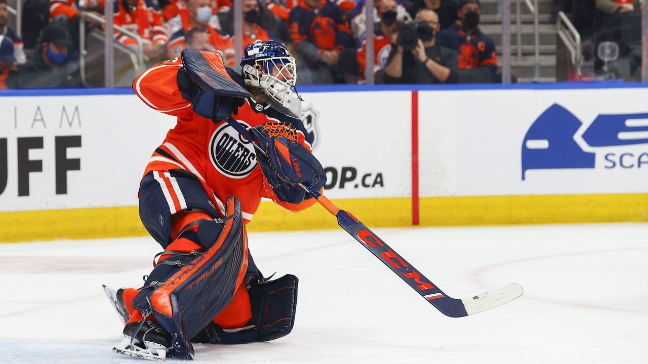 EDMONTON, AB - OCTOBER 13: Edmonton Oilers Goalie Mike Smith (41) passes the puck up ice in the second period during the Edmonton Oilers game versus the Vancouver Canucks on October 13, 2021 at Rogers Place in Edmonton, AB.