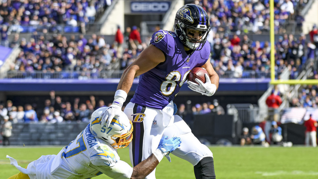 BALTIMORE, MD - OCTOBER 17: Baltimore Ravens tight end Mark Andrews (89) makes a reception against Los Angeles Chargers linebacker Amen Ogbongbemiga (57) during the Los Angeles Charger game versus the Baltimore Ravens on October 17, 2021 at M&T Bank Stadium in Baltimore, MD.