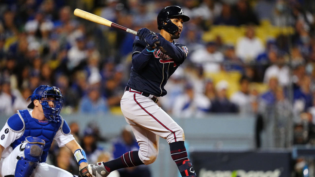 LOS ANGELES, CA - OCTOBER 20: Eddie Rosario #8 of the Atlanta Braves hits a single in the fifth inning during Game 4 of the NLCS between the Atlanta Braves and the Los Angeles Dodgers at Dodgers Stadium on Wednesday, October 20, 2021 in Los Angeles, California.