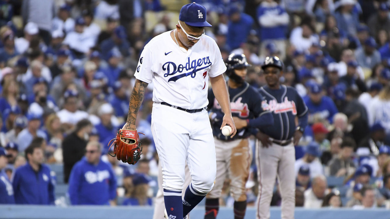 Los Angeles, CA - October 20: Los Angeles Dodgers starting pitcher Julio Urias reacts after allowing a triple to Atlanta Braves' Eddie Rosario during the third inning in game four in the 2021 National League Championship Series at Dodger Stadium on Wednesday, Oct. 20, 2021 in Los Angeles, CA. (Wally Skalij / Los Angeles Times via Getty Images)