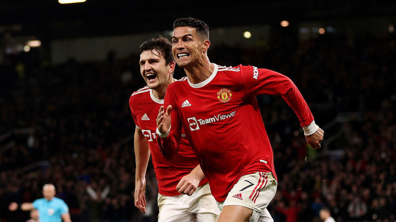 MANCHESTER, ENGLAND - OCTOBER 20: Cristiano Ronaldo of Manchester United celebrates with teammate Harry Maguire after scoring their side's third goal during the UEFA Champions League group F match between Manchester United and Atalanta at Old Trafford on October 20, 2021 in Manchester, England.