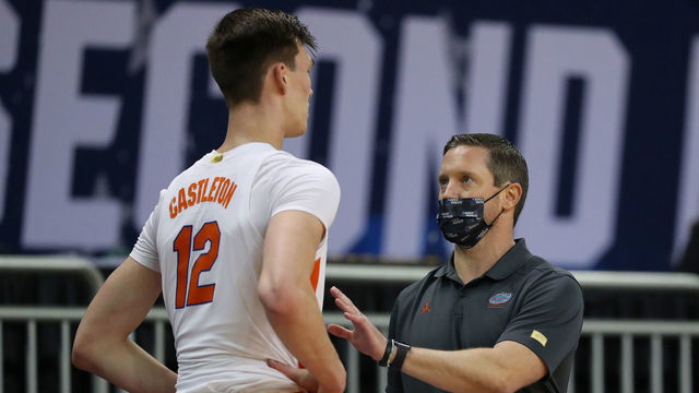 INDIANAPOLIS, INDIANA - MARCH 21: Head coach Mike White of the Florida Gators speaks to Colin Castleton #12 in the first half against the Oral Roberts Golden Eagles in the second round game of the 2021 NCAA Men's Basketball Tournament at Indiana Farmers Coliseum on March 21, 2021 in Indianapolis, Indiana.