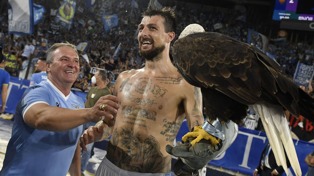 OLIMPICO STADIUM, ROMA, ITALY - 2021/09/26: Francesco Acerbi of SS Lazio celebrates with the eagle Olimpia after the victory of the Serie A football match between SS Lazio and AS Roma. SS Lazio won 3-2 over AS Roma.