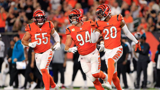 CINCINNATI, OH - SEPTEMBER 30: Cincinnati Bengals cornerback Eli Apple (20), defensive end Sam Hubbard (94) and linebacker Logan Wilson (55) react after making a stop during the game against the Jacksonville Jaguars and the Cincinnati Bengals on September 30, 2021, at Paul Brown Stadium in Cincinnati, OH.
