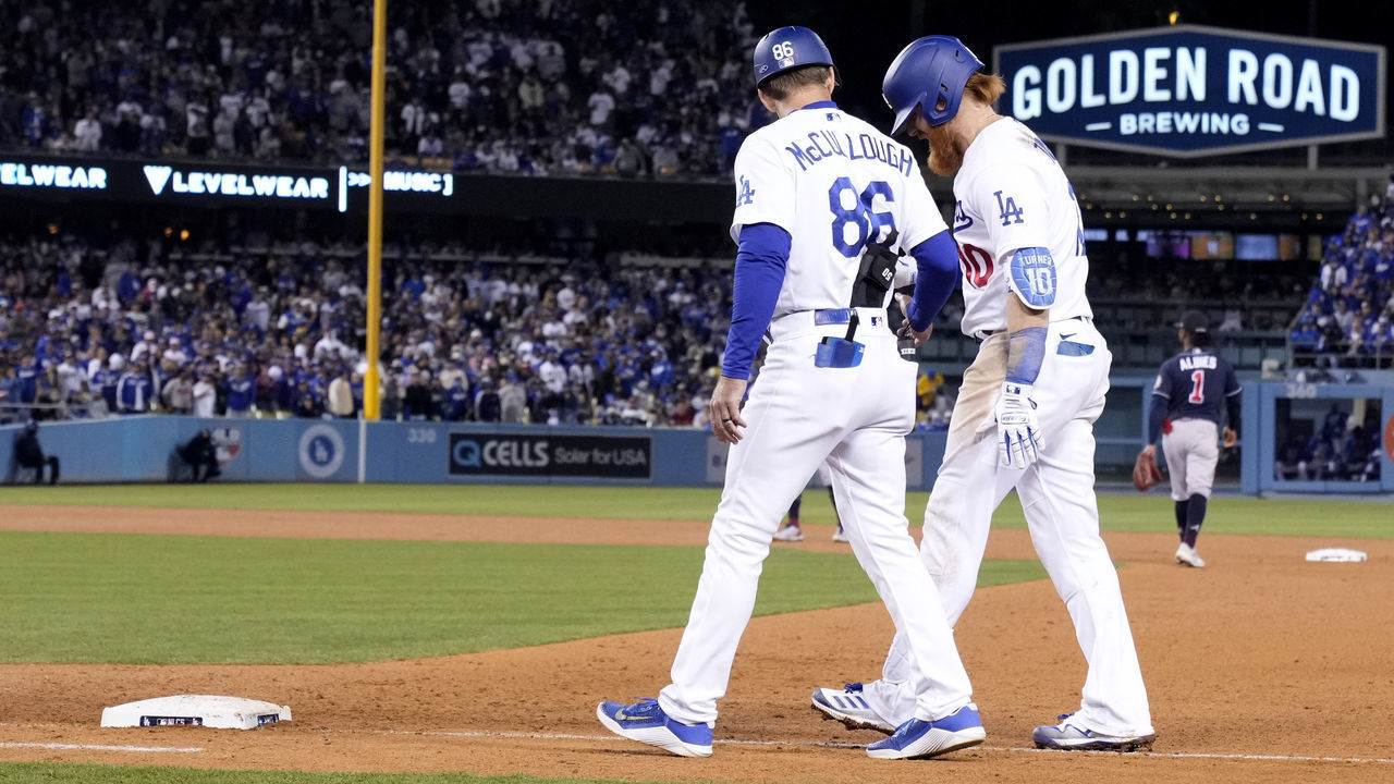 Los Angeles, CA - October 20: Justin Turner #10 of the Los Angeles Dodgers holds his leg as he walks off the field with an injury against the Atlanta Braves during Game 4 during a National League Championship Series baseball game at Dodger Stadium in Los Angeles on Wednesday, October 20, 2021.