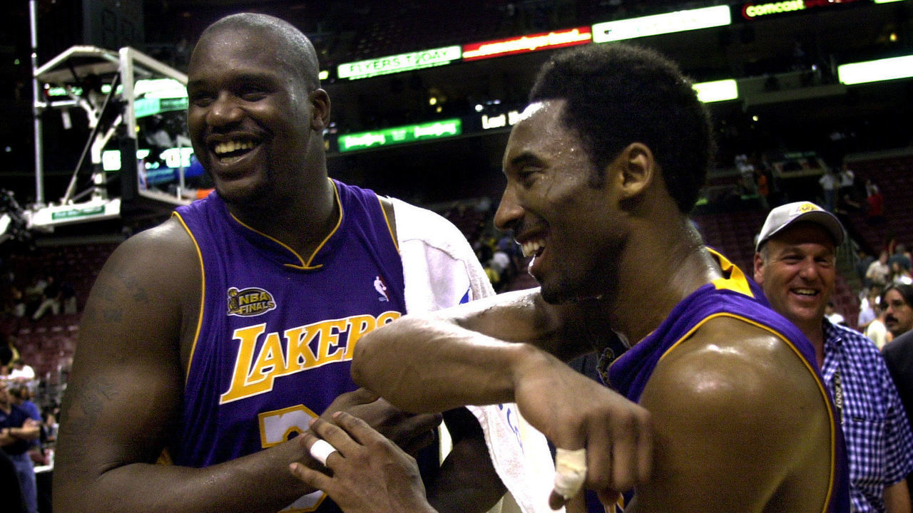 031390.SP.0613.lakers9.WS Lakers Shaquille O'Neal and Kobe Bryant celebrate after defeating the 76ers in Game 4 of the NBA Finals in Philadelphia Wednesday June 13, 2001.