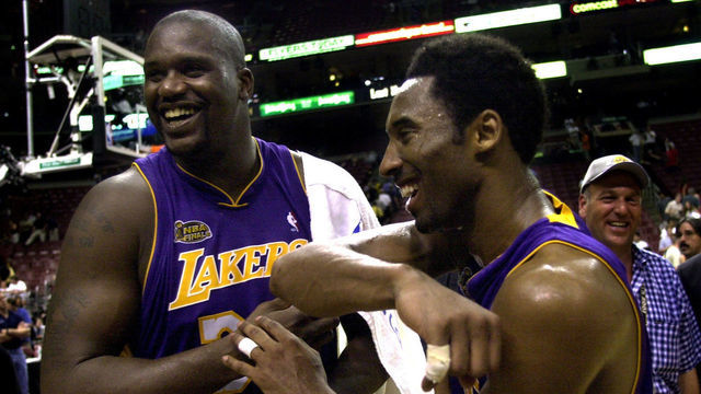 031390.SP.0613.lakers9.WS Lakers Shaquille O'Neal and Kobe Bryant celebrate after defeating the 76ers in Game 4 of the NBA Finals in Philadelphia Wednesday June 13, 2001.