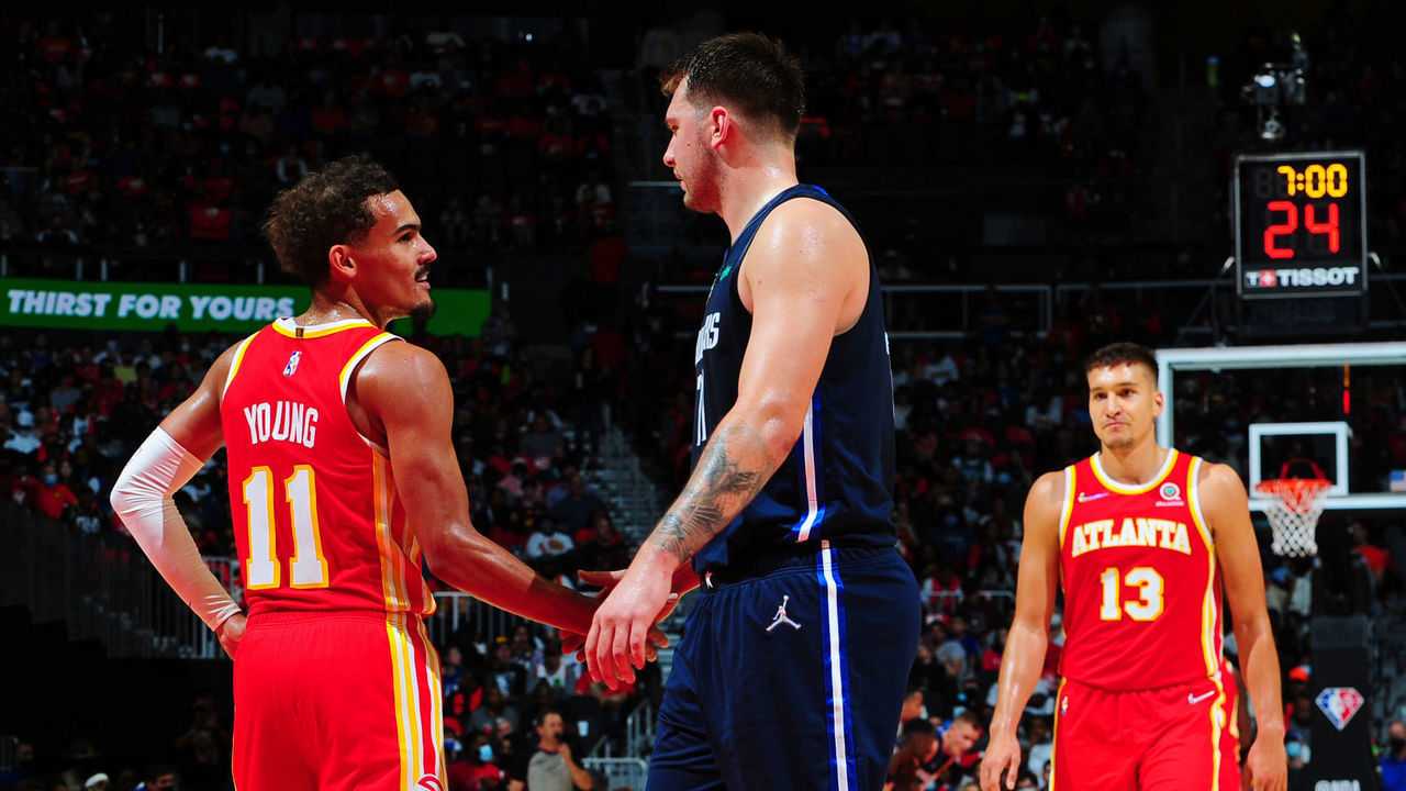 ATLANTA, GA - OCTOBER 21: Trae Young #11 of the Atlanta Hawks and Luka Doncic #77 of the Dallas Mavericks high five during the game on October 21, 2021 at State Farm Arena in Atlanta, Georgia. NOTE TO USER: User expressly acknowledges and agrees that, by downloading and/or using this Photograph, user is consenting to the terms and conditions of the Getty Images License Agreement. Mandatory Copyright Notice: Copyright 2021 NBAE