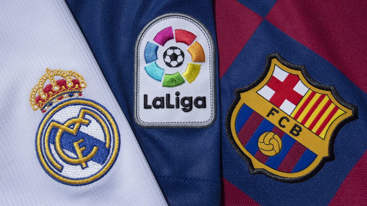 MANCHESTER, ENGLAND - JULY 22: The La Liga logo with the FC Barcelona and Real Madrid club crests on the first team home shirts on July 22, 2020 in Manchester, United Kingdom.