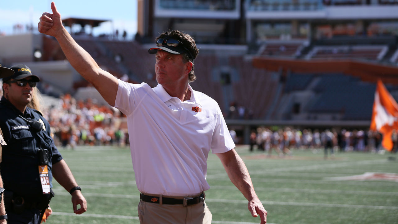 OCTOBER 16: Oklahoma State Cowboys head coach Mike Gundy reacts to the crowd after defeating the University of Texas on October 16, 2021, at Darrell K Royal - Texas Memorial Stadium in Austin, TX.