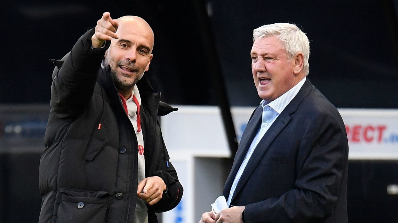 Manchester City's Spanish manager Pep Guardiola (L) talks with Newcastle United's English head coach Steve Bruce ahead of the English Premier League football match between Newcastle United and Manchester City at St James' Park in Newcastle-upon-Tyne, north east England on May 14, 2021. - RESTRICTED TO EDITORIAL USE. No use with unauthorized audio, video, data, fixture lists, club/league logos or 'live' services. Online in-match use limited to 120 images. An additional 40 images may be used in extra time. No video emulation. Social media in-match use limited to 120 images. An additional 40 images may be used in extra time. No use in betting publications, games or single club/league/player publications.