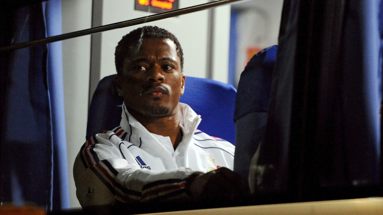 France's defender Patrice Evra is pictured in the bus outside Bloemfontein airport on June 21, 2010 during the 2010 World Cup tournament in South Africa. France were plunged into crisis on June 20 when the players refused to train in solidarity with striker Nicolas Anelka who had been sent home for a foul-mouthed rant at coach Raymond Domenech. AFP PHOTO / FRANCK FIFE