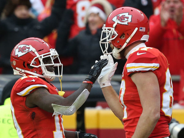 KANSAS CITY, MO - JANUARY 12: Kansas City Chiefs wide receiver Tyreek Hill (10) high fives tight end Travis Kelce (87) after Kelce drew a pass-interference call in the second quarter of an NFL Divisional round playoff game between the Houston Texans and Kansas City Chiefs on January 12, 2020 at Arrowhead Stadium in Kansas City, MO.