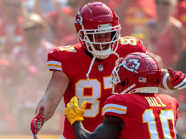 KANSAS CITY, MO - SEPTEMBER 12: Kansas City Chiefs tight end Travis Kelce (87) and Kansas City Chiefs wide receiver Tyreek Hill (10) embrace on the field prior to the game against the Cleveland Browns on September 12th at GEHA field at Arrowhead Stadium in Kansas City, Missouri.