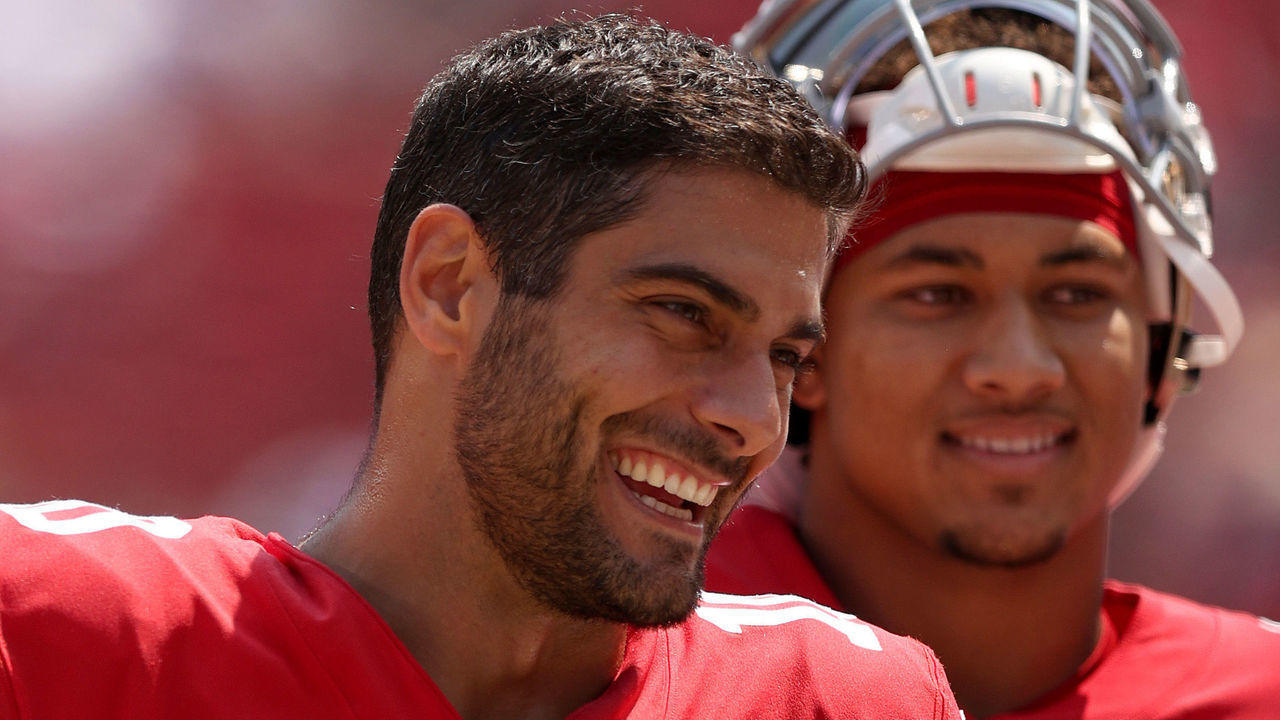 SANTA CLARA, CALIFORNIA - AUGUST 29: Jimmy Garoppolo #10 and Trey Lance #5 of the San Francisco 49ers talk to each other on the sidelines before their preseason game against the Las Vegas Raiders at Levi's Stadium on August 29, 2021 in Santa Clara, California.