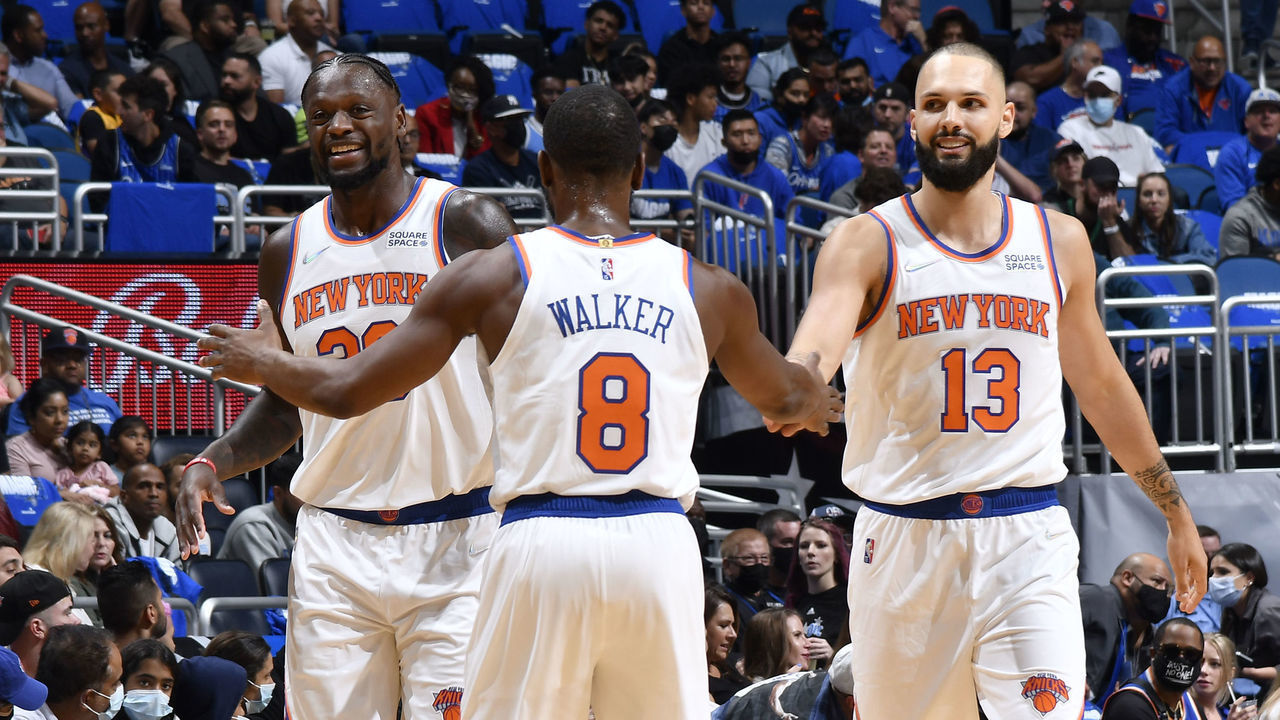 ORLANDO, FL - OCTOBER 22: Julius Randle #30 and Evan Fournier #13 of the New York Knicks high five Kemba Walker #8 of the New York Knicks on October 22, 2021 at Amway Center in Orlando, Florida. Mandatory Copyright Notice: Copyright 2021 NBAE
