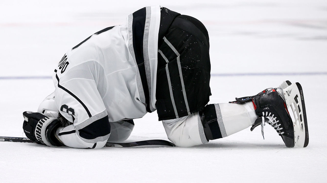 DALLAS, TEXAS - OCTOBER 22: Drew Doughty #8 of the Los Angeles Kings lays on the ice after being tripped by the Dallas Stars in the second period at American Airlines Center on October 22, 2021 in Dallas, Texas.
