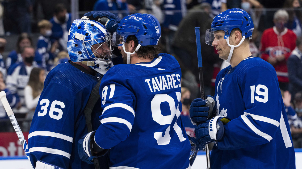 Toronto, ON - OCTOBER 13: Jack Campbell #36 of the Toronto Maple Leafs celebrates with teammate John Tavares #91 after defeating the Montreal Canadiens at the Scotiabank Arena on October 13, 2021 in Toronto, Ontario, Canada.