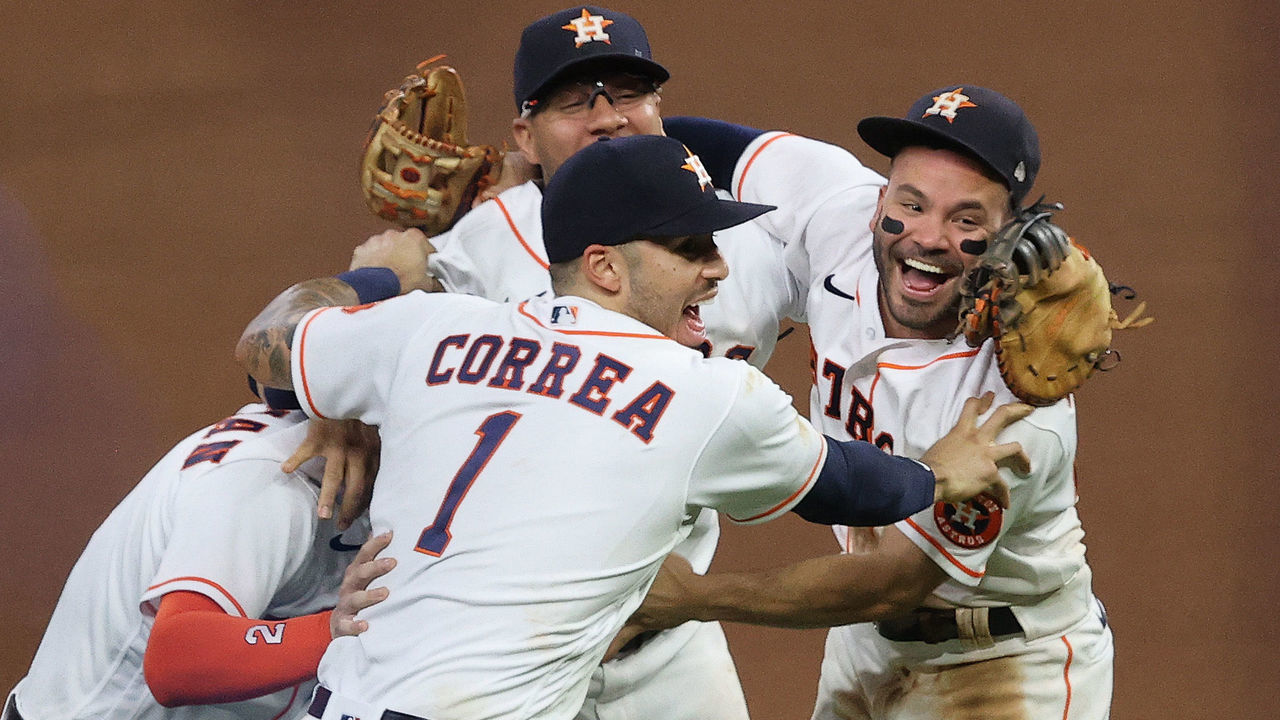 HOUSTON, TEXAS - OCTOBER 22: Yuli Gurriel #10, Alex Bregman #2, Jose Altuve #27 and Carlos Correa #1 of the Houston Astros celebrate after the final out as they defeat the Boston Red Sox 5-0 in Game Six of the American League Championship Series to advance to the World Series at Minute Maid Park on October 22, 2021 in Houston, Texas.