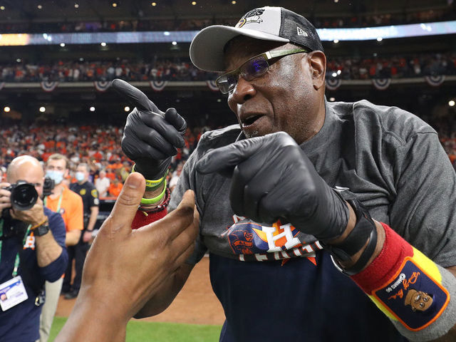 HOUSTON, TEXAS - OCTOBER 22: Manager Dusty Baker #12 of the Houston Astros celebrates after defeating the Boston Red Sox 5-0 in Game Six of the American League Championship Series to advance to the World Series at Minute Maid Park on October 22, 2021 in Houston, Texas.