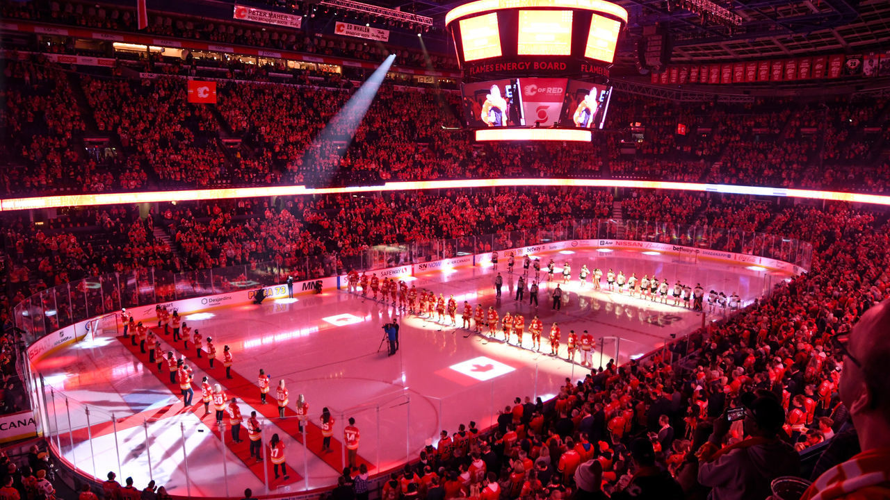 CALGARY, AB - OCTOBER 18: A general view of the arena as fans and players stand for the national anthems ahead of an NHL game where the Calgary Flames hosted the Anaheim Ducks on October 18, 2021, at the Scotiabank Saddledome in Calgary, AB.