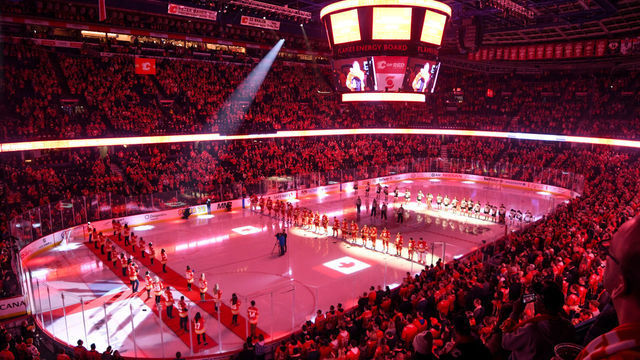 CALGARY, AB - OCTOBER 18: A general view of the arena as fans and players stand for the national anthems ahead of an NHL game where the Calgary Flames hosted the Anaheim Ducks on October 18, 2021, at the Scotiabank Saddledome in Calgary, AB.