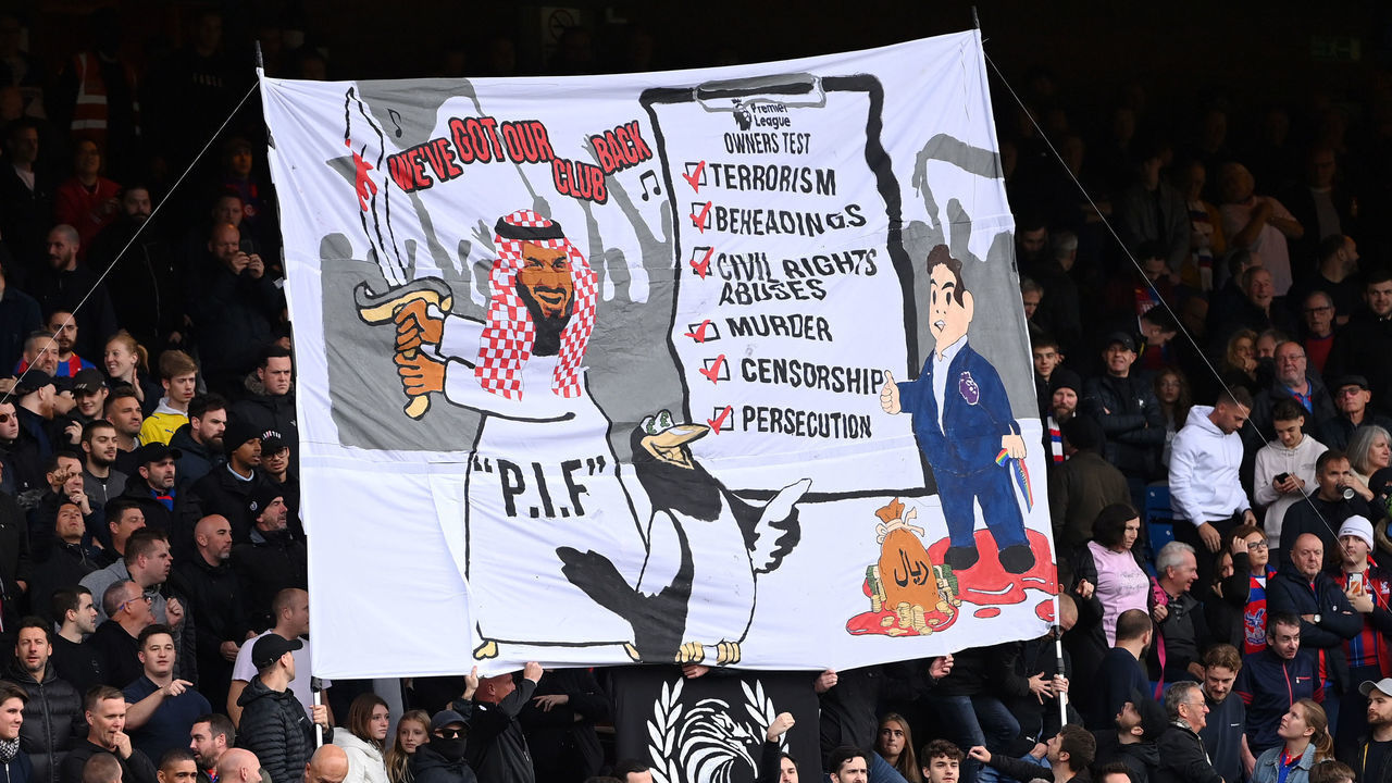 LONDON, ENGLAND - OCTOBER 23: A banner relating to the owners of Newcastle United is seen in the home end during the Premier League match between Crystal Palace and Newcastle United at Selhurst Park on October 23, 2021 in London, England.
