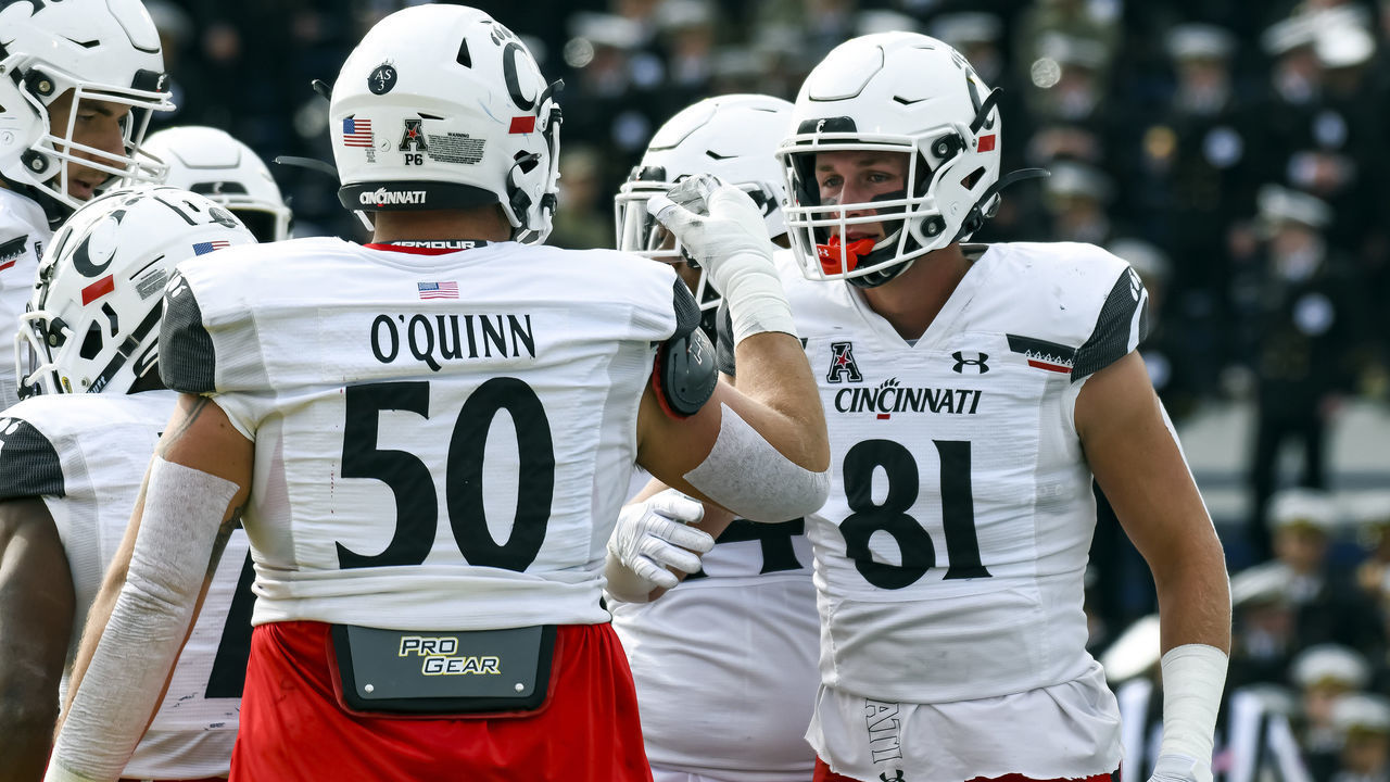 ANNAPOLIS, MD - OCTOBER 23: Cincinnati Bearcats tight end Josh Whyle (81) celebrates with offensive lineman Dylan O'Quinn (50) after scoring on a receiving touchdown against during the University of Cincinnati game versus the Navy on October 23, 2021 at Navy - Marine Corps Memorial Stadium in Annapolis, MD.