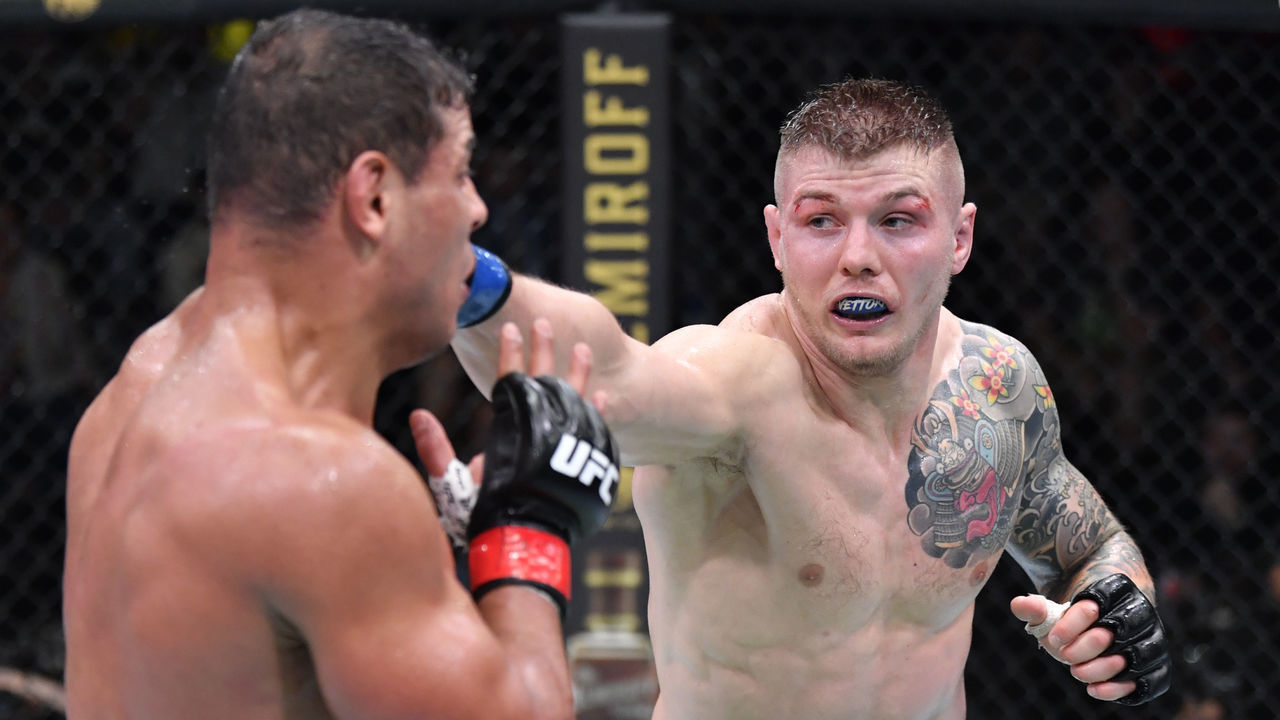 LAS VEGAS, NEVADA - OCTOBER 23: (R-L) Marvin Vettori of Italy punches Paulo Costa of Brazil in a light heavyweight fight during the UFC Fight Night event at UFC APEX on October 23, 2021 in Las Vegas, Nevada.