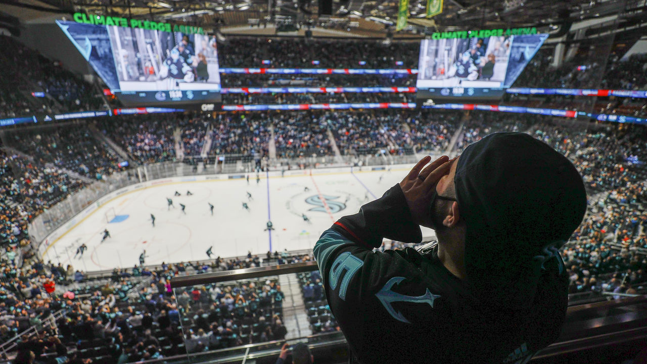 SEATTLE, WASHINGTON - OCTOBER 23: A fan cheers prior to the Seattle Kraken's inaugural home opening game against the Vancouver Canucks on October 23, 2021 at the Climate Pledge Arena in Seattle, Washington.