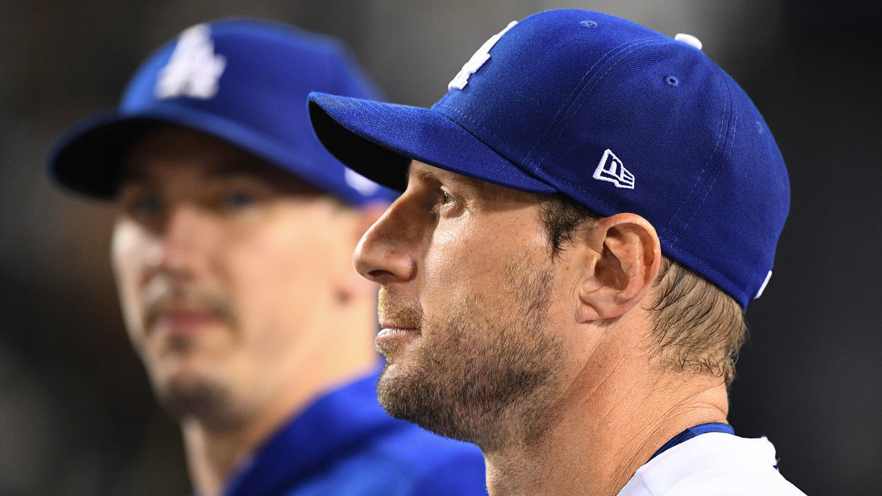 LOS ANGELES, CA - OCTOBER 06: Los Angeles Dodgers pitcher Max Scherzer (31) and Los Angeles Dodgers pitcher Walker Buehler (21) look on during the MLB National League Wild Card game between the St. Louis Cardinals and the Los Angeles Dodgers on October 6, 2021 at Dodger Stadium in Los Angeles, CA.
