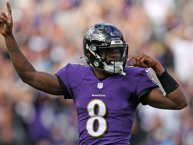 BALTIMORE, MARYLAND - OCTOBER 17: Lamar Jackson #8 of the Baltimore Ravens celebrates a rushing touchdown scored by Latavius Murray #28 during the first quarter against the Los Angeles Chargers at M&T Bank Stadium on October 17, 2021 in Baltimore, Maryland.