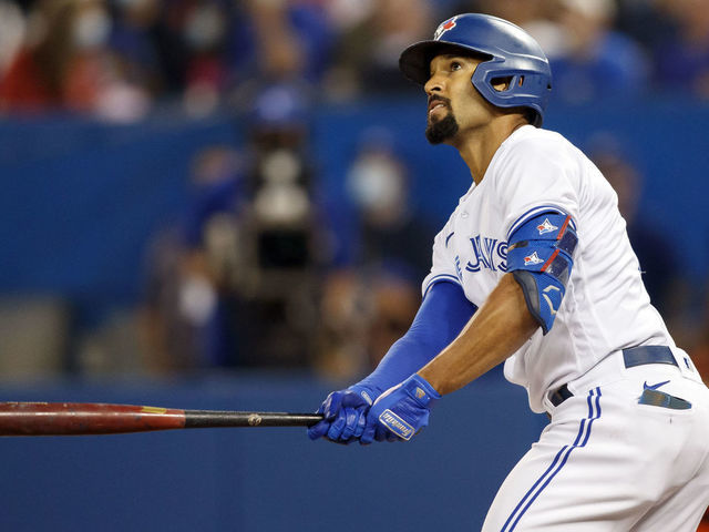 TORONTO, ON - OCTOBER 01: Marcus Semien #10 of the Toronto Blue Jays swings in the first inning of their MLB game against the Baltimore Orioles at Rogers Centre on October 1, 2021 in Toronto, Ontario.