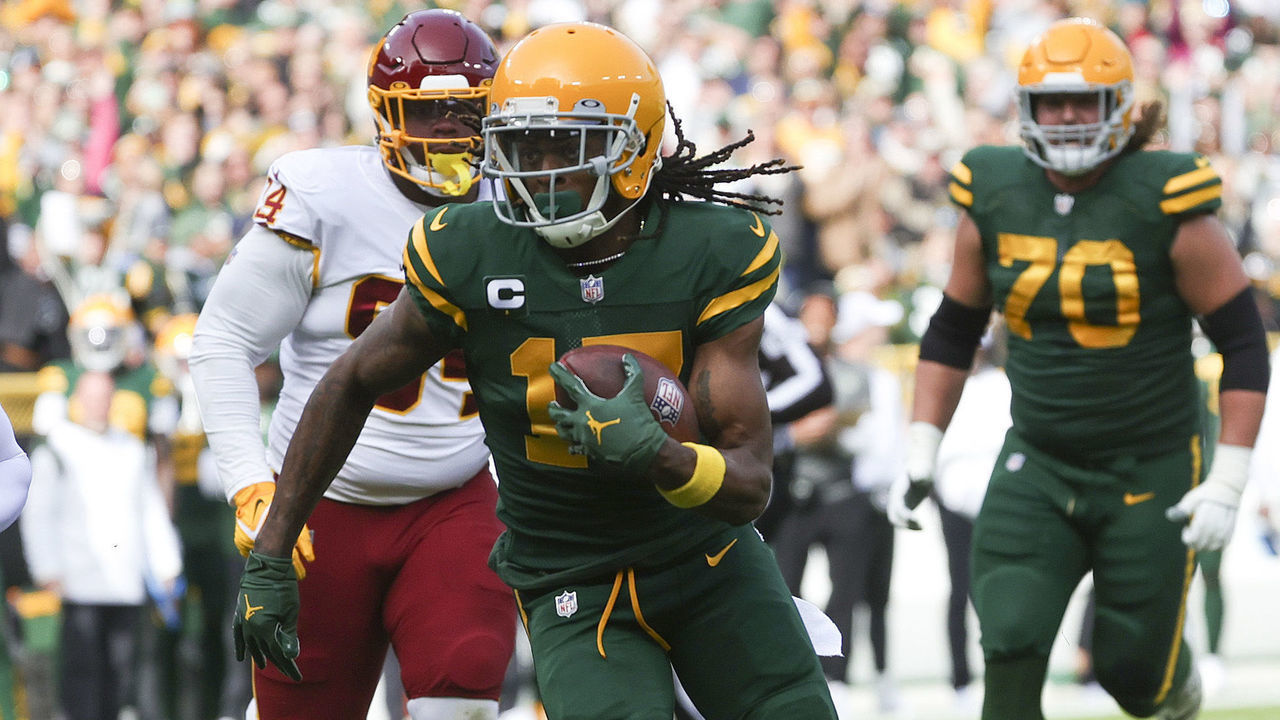 GREEN BAY, WISCONSIN - OCTOBER 24: Davante Adams #17 of the Green Bay Packers runs with the ball in the first quarter against the Washington Football Team in the game at Lambeau Field on October 24, 2021 in Green Bay, Wisconsin.