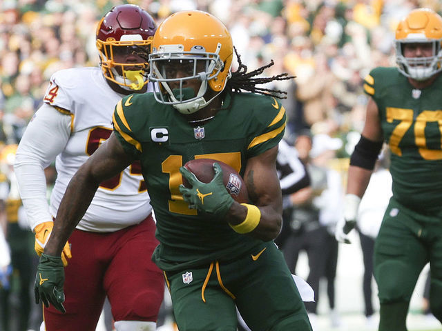 GREEN BAY, WISCONSIN - OCTOBER 24: Davante Adams #17 of the Green Bay Packers runs with the ball in the first quarter against the Washington Football Team in the game at Lambeau Field on October 24, 2021 in Green Bay, Wisconsin.