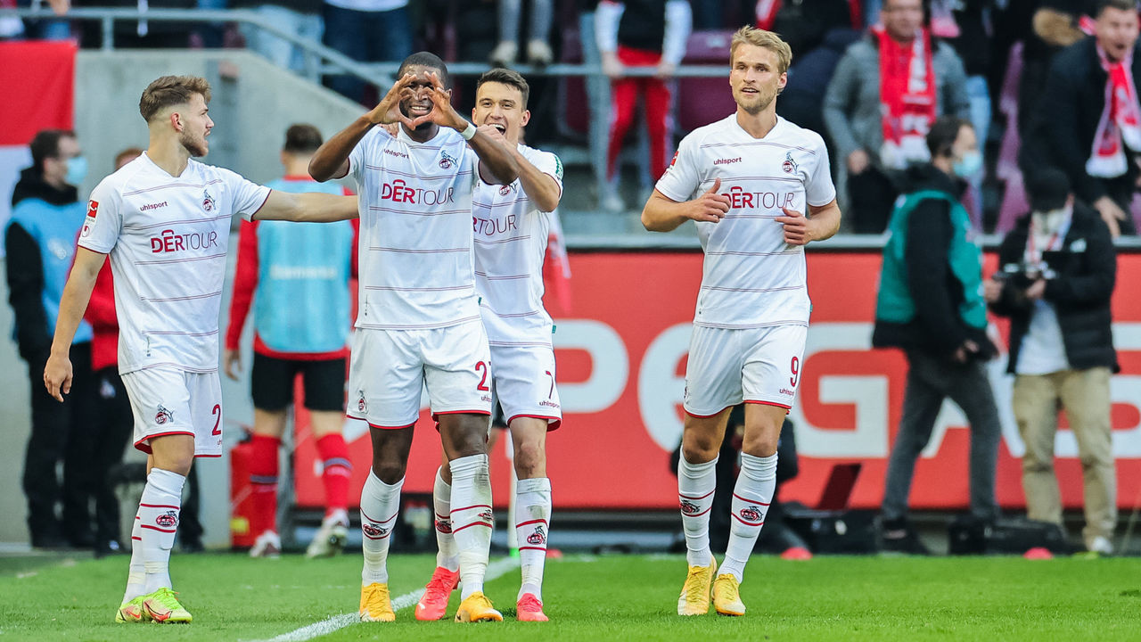 dpatop - 24 October 2021, North Rhine-Westphalia, Cologne: Football: Bundesliga, 1st FC Cologne - Bayer Leverkusen, Matchday 9, RheinEnergieStadion. Cologne's Anthony Modeste (2nd from left) is delighted with his goal to make it 2:2. Photo: Rolf Vennenbernd/dpa - IMPORTANT NOTE: In accordance with the regulations of the DFL Deutsche Fußball Liga and/or the DFB Deutscher Fußball-Bund, it is prohibited to use or have used photographs taken in the stadium and/or of the match in the form of sequence pictures and/or video-like photo series.