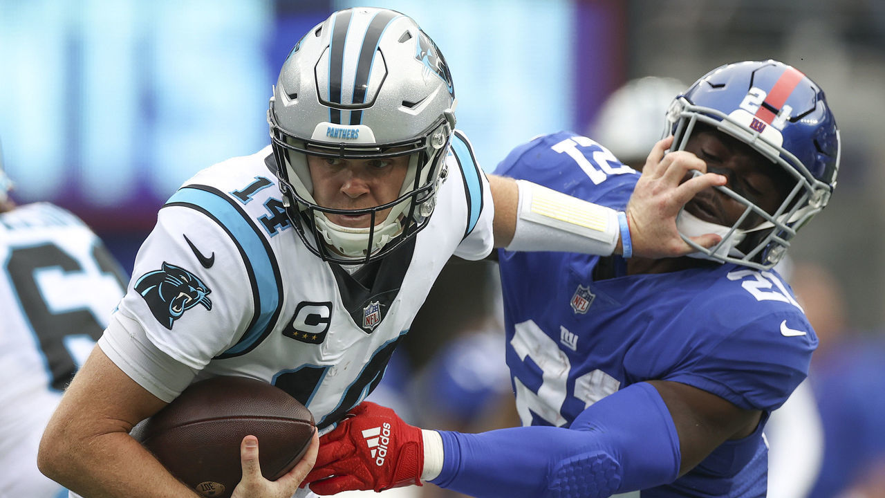 EAST RUTHERFORD, NEW JERSEY - OCTOBER 24: Sam Darnold #14 of the Carolina Panthers is sacked by Jabrill Peppers #21 of the New York Giants during the first half in the game at MetLife Stadium on October 24, 2021 in East Rutherford, New Jersey.