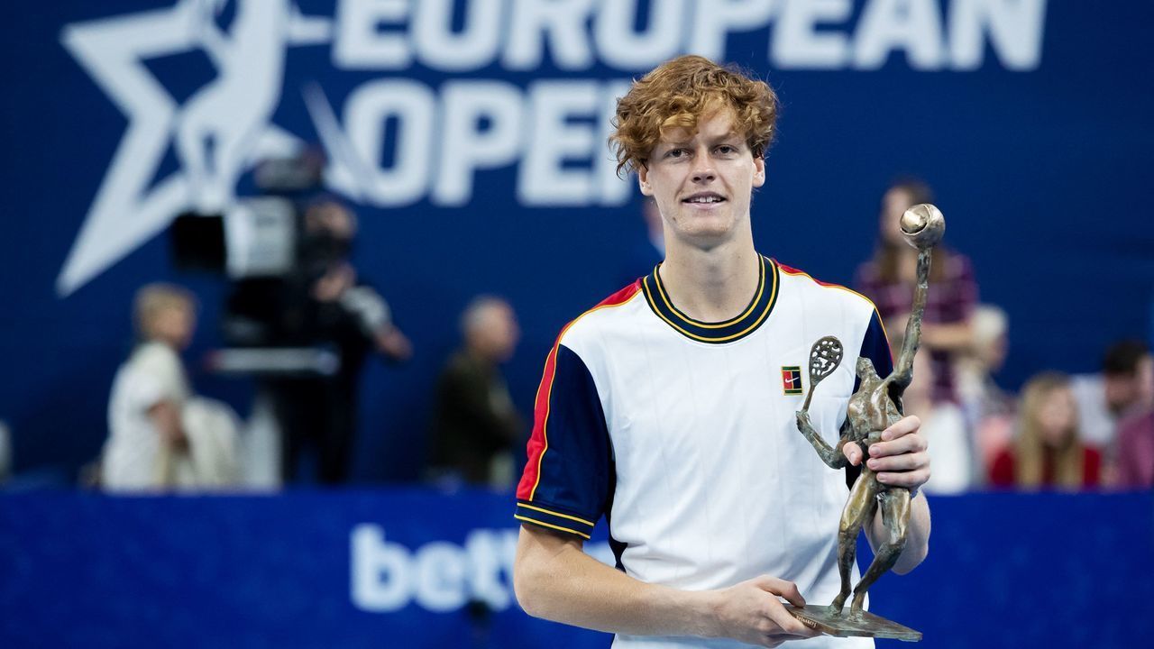Italy's Jannik Sinner holds the winner's trophy after winning the ATP European Open final tennis match against Argentina's Diego Schwartzman in Antwerp on October 24, 2021. - Belgium OUT
